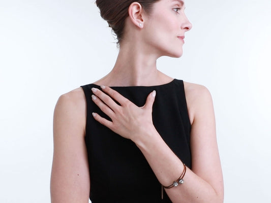 Woman wearing an antique pearl and diamond bangle