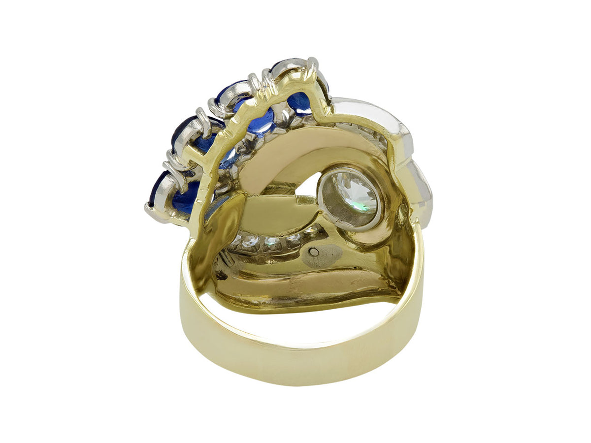 Rear view of an 18K gold ring with sapphires and diamonds