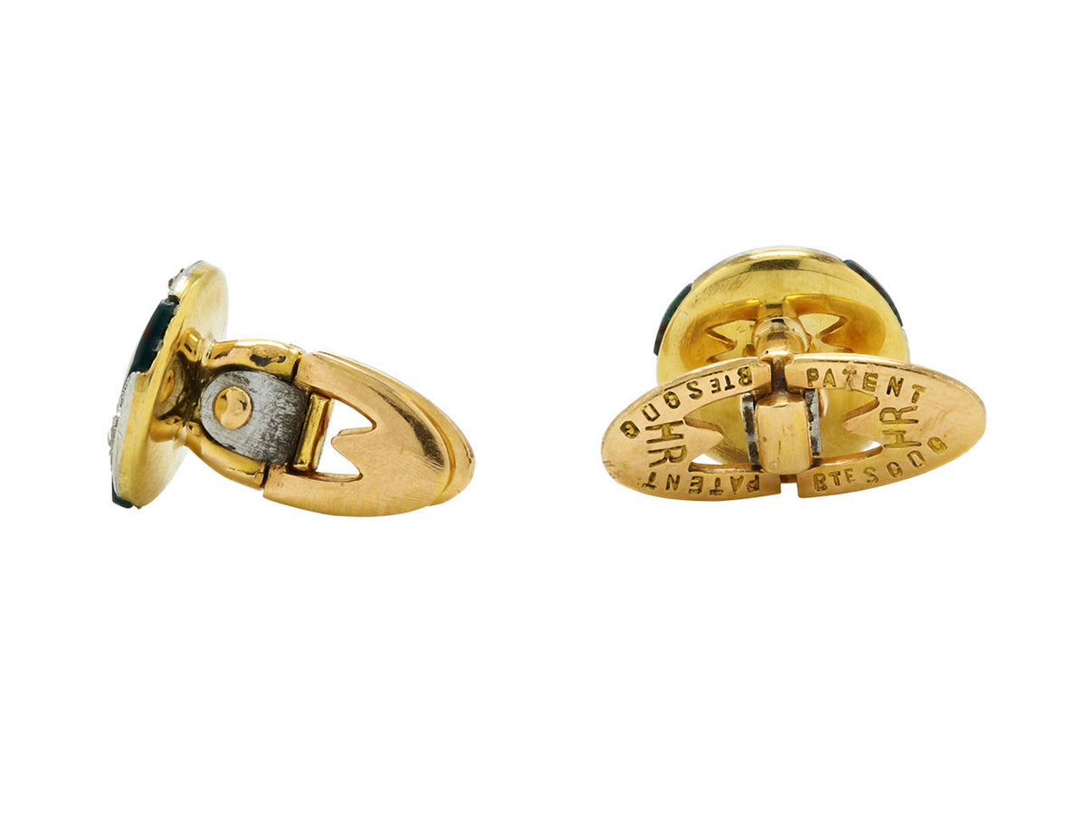 Gold cufflinks with dark stone panels shown from side