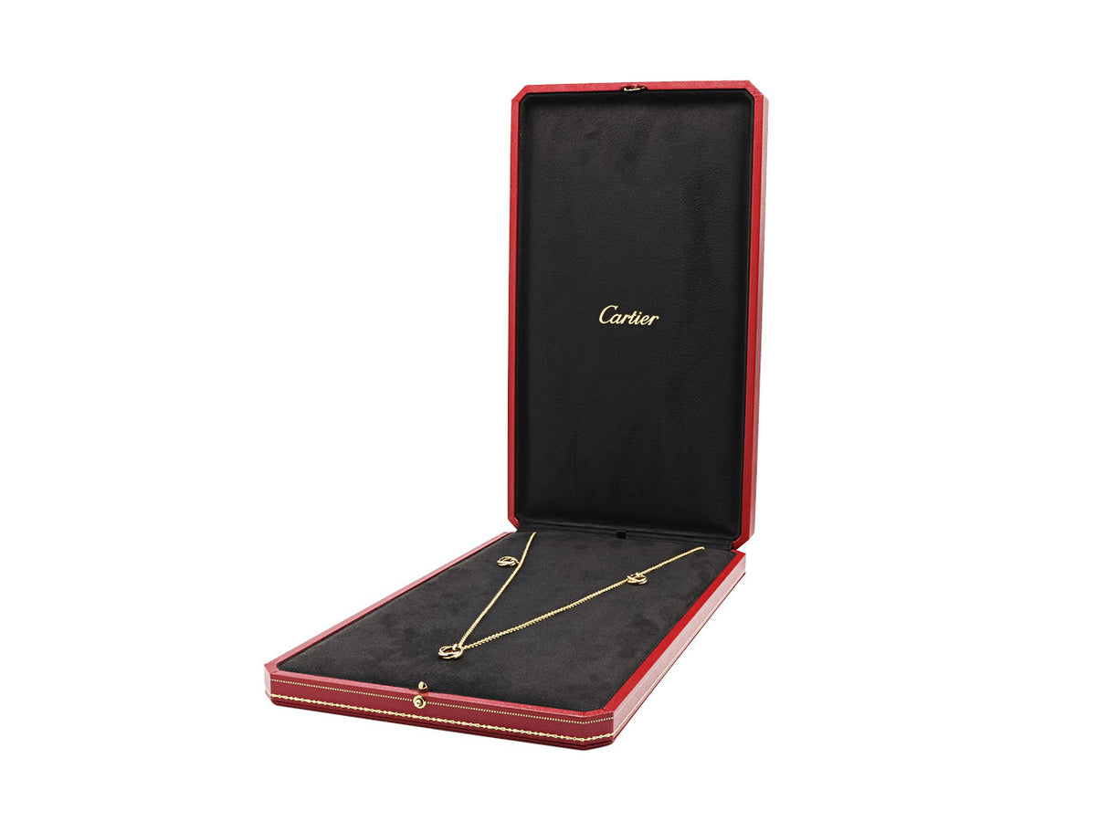 Cartier Trinity station necklace in open jewelry case