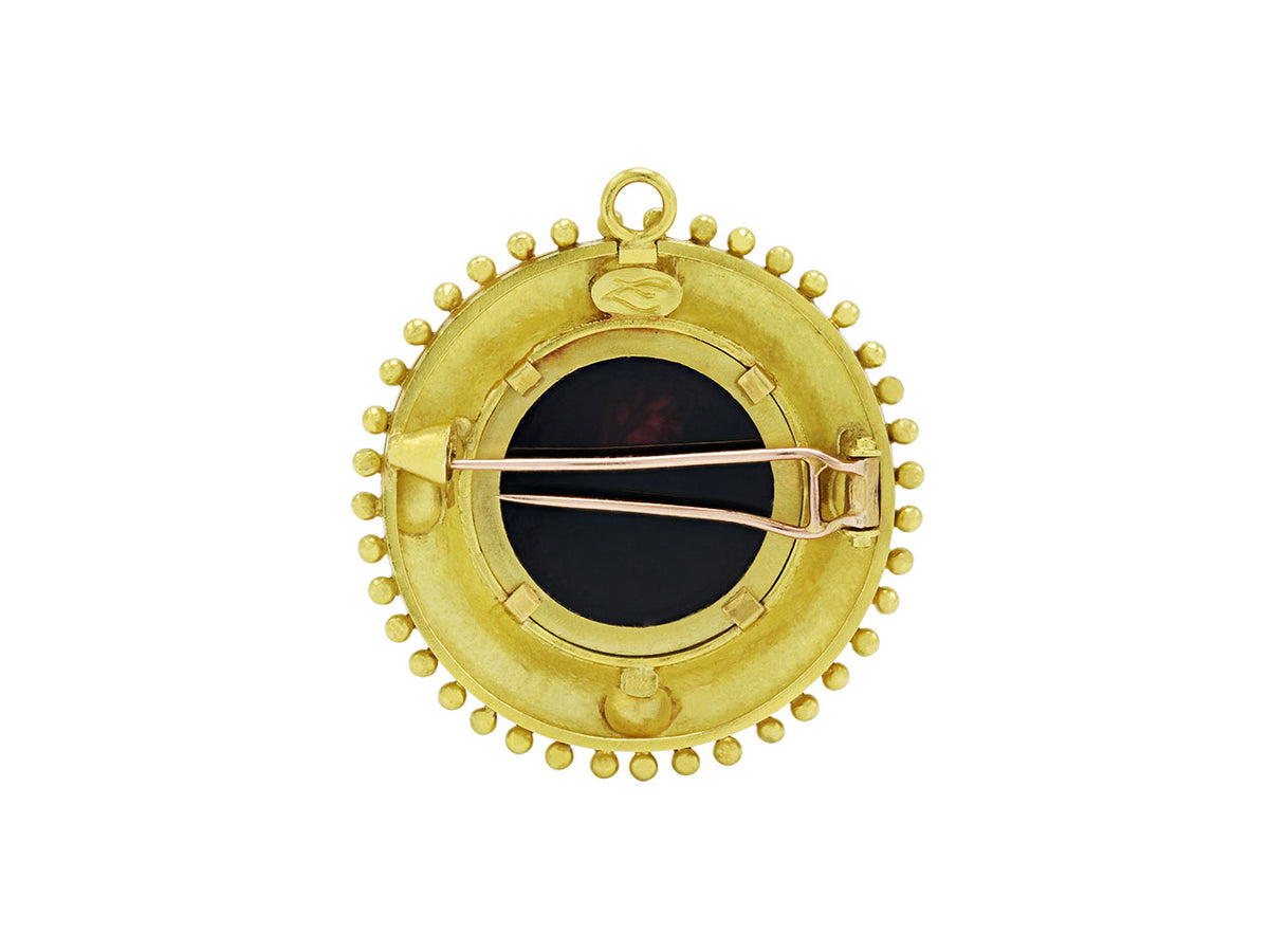 Back view of round 18K yellow gold brooch with pin closure and pendant bail