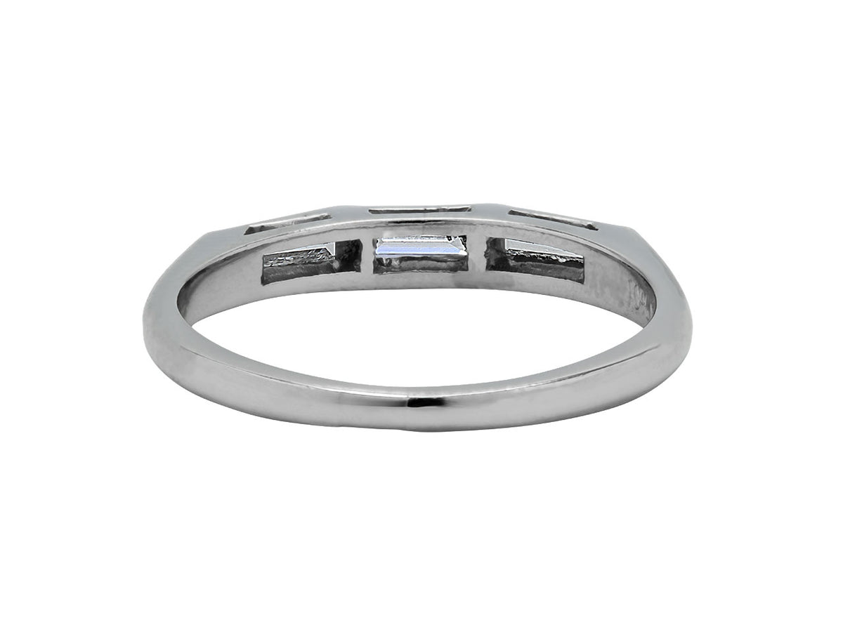 Platinum ring with three baguette diamond settings