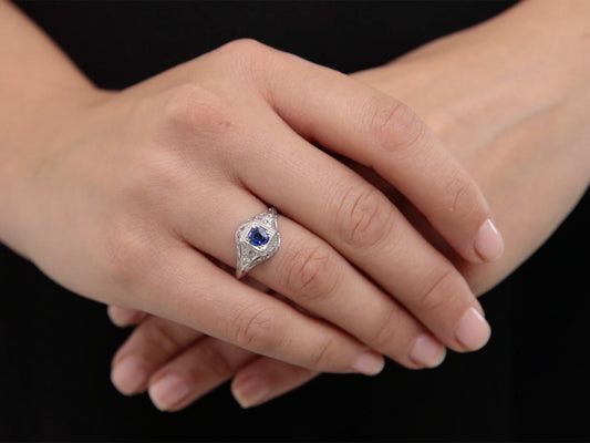 Sapphire and diamond ring worn on hand