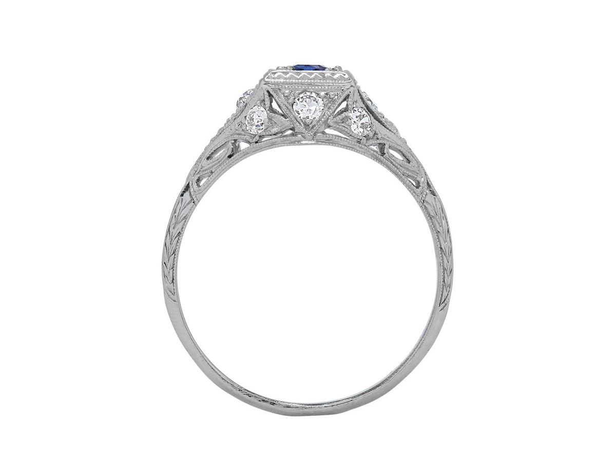 Side view of platinum ring with sapphire and diamonds