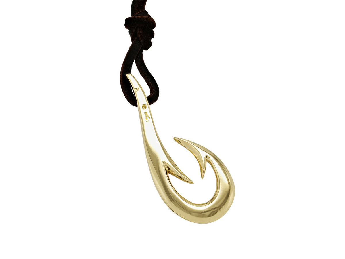 Gold fish hook pendant on black leather cord