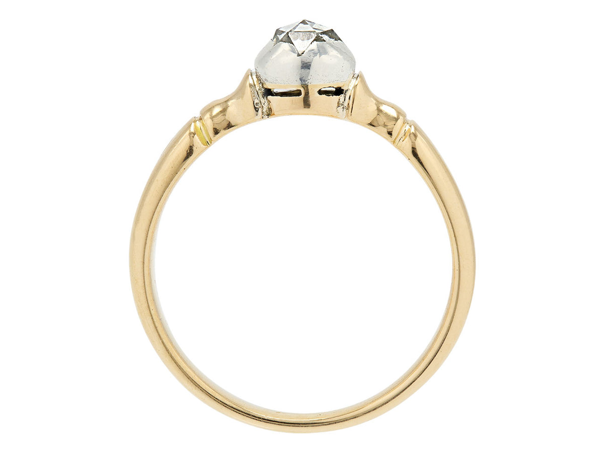 Side view of antique gold ring with raised diamond setting