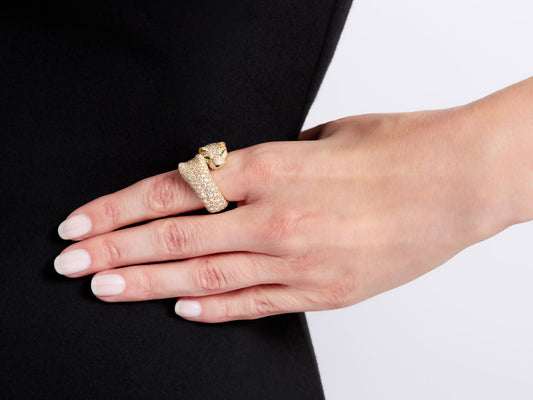 Diamond panther ring in yellow gold worn on a hand