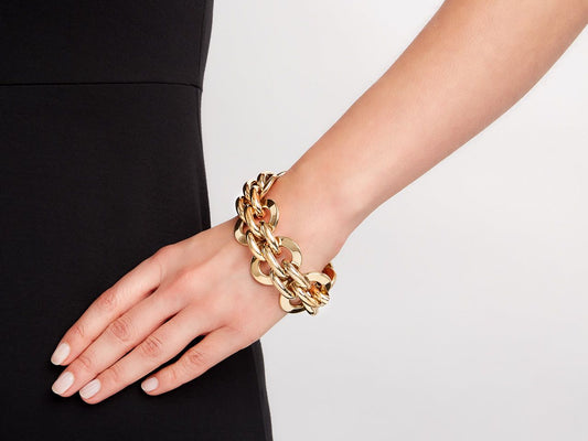 18K yellow gold link bracelet worn on wrist