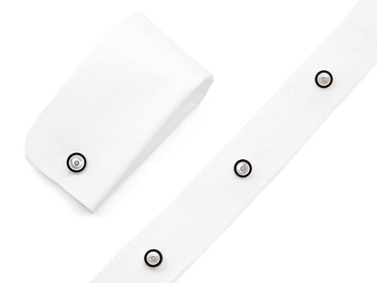 White shirt cuffs with black onyx and mother of pearl studs