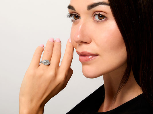 Woman wearing an Art Deco platinum diamond ring