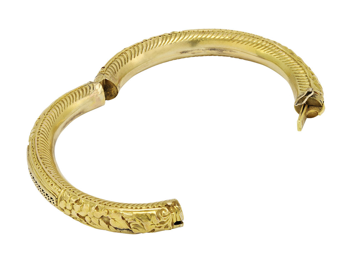 Antique 18K gold hinged bangle with foliate carving