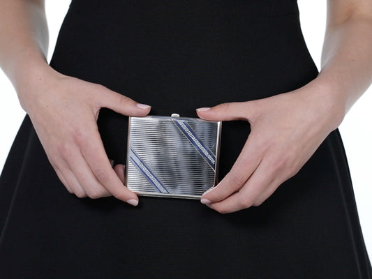 Silver cigarette case with blue and white geometric enamel design