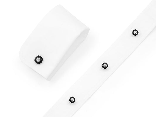 White shirt cuffs with onyx and diamond studs