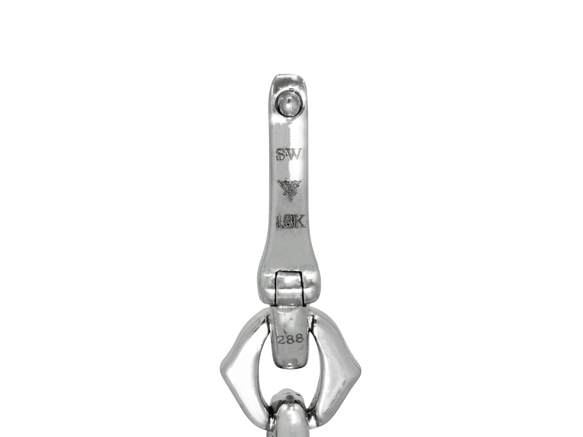 Close up of white gold earring with SW hallmark
