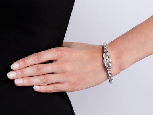 Art Deco platinum diamond watch worn on wrist