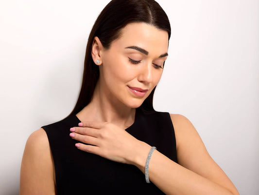 Woman wearing a three row diamond bracelet
