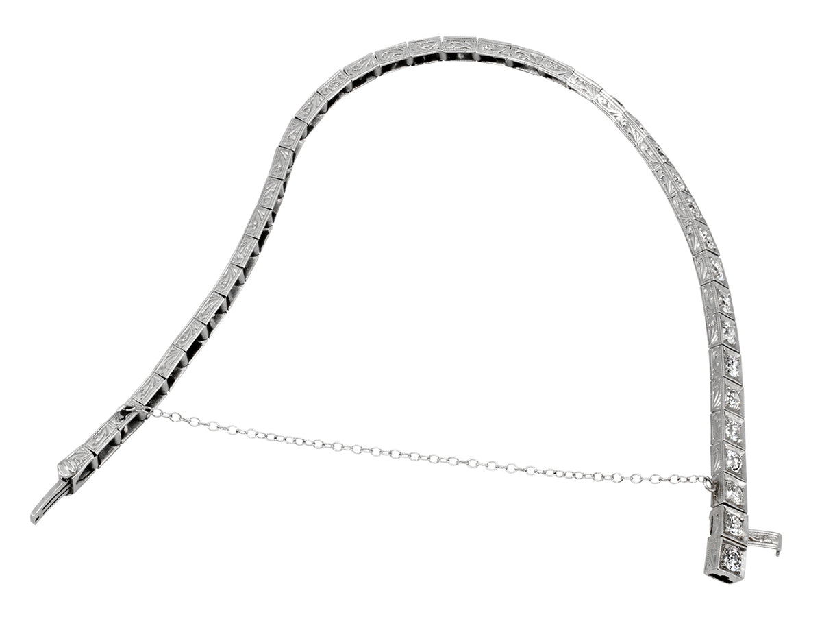 Platinum bracelet with square diamond set links