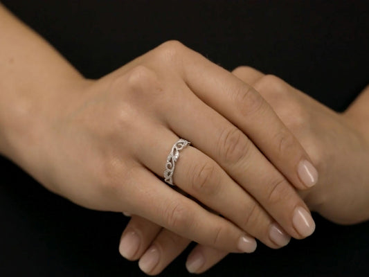 18K white gold vine diamond ring worn on hand