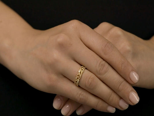 18K gold diamond vine ring worn on a hand