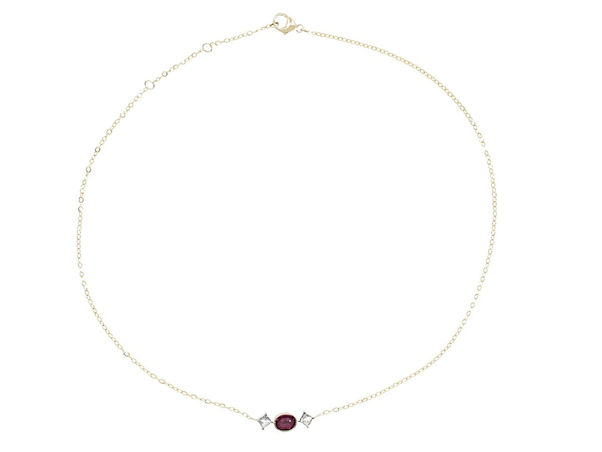 Gold ruby and diamond necklace on white background