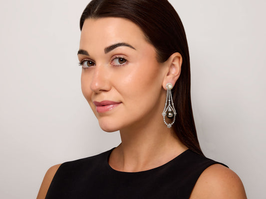 Woman wearing a diamond and pearl drop earring