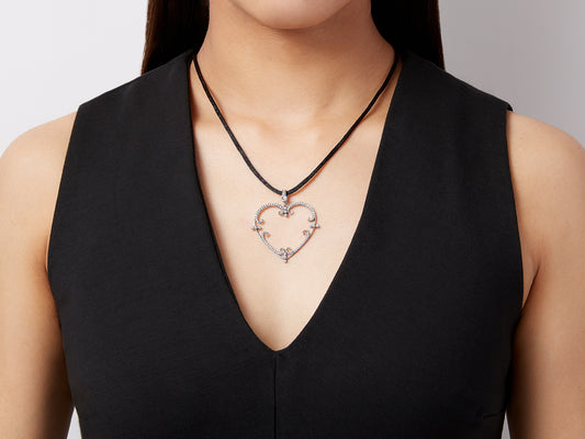 Open heart diamond pendant in white gold on model