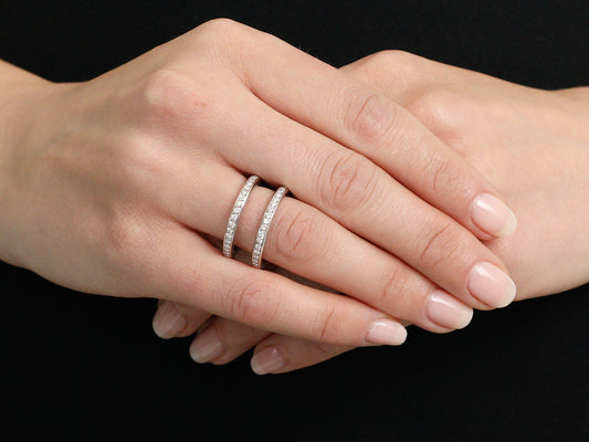 Hand wearing a double diamond band in white gold