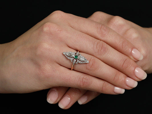 Antique Edwardian emerald ring worn on a hand