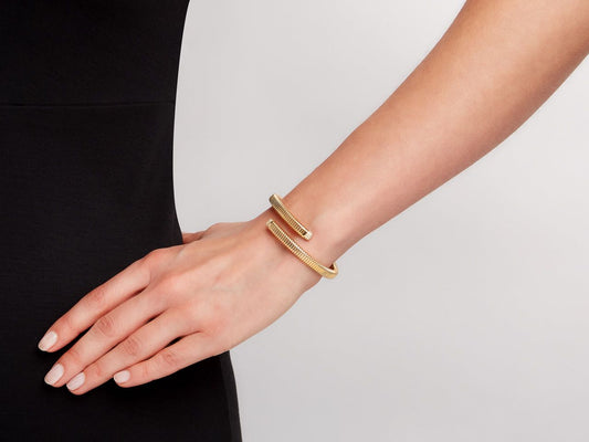 18K gold tubogas bypass bracelet with diamond terminals