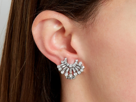 Diamond fan earring in platinum worn on ear