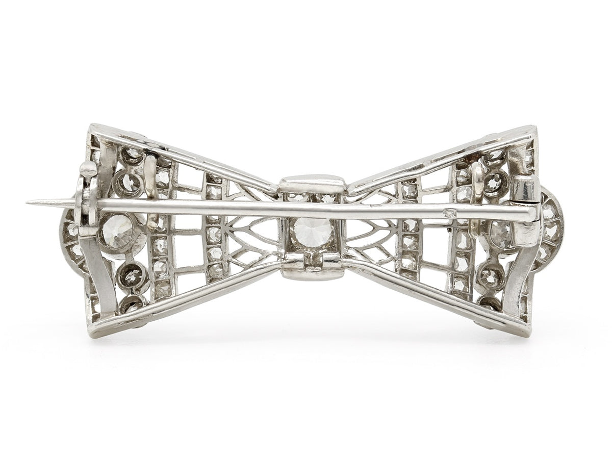 Back view of an openwork platinum bow pin