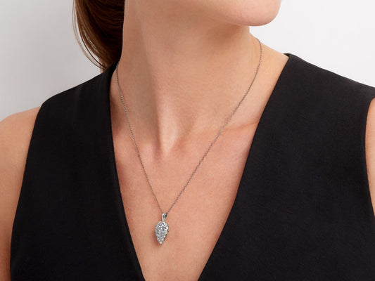 Woman wearing a teardrop diamond pendant necklace