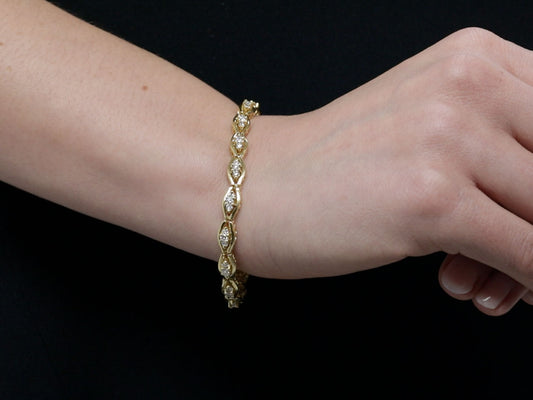 18K gold diamond bracelet worn on a wrist