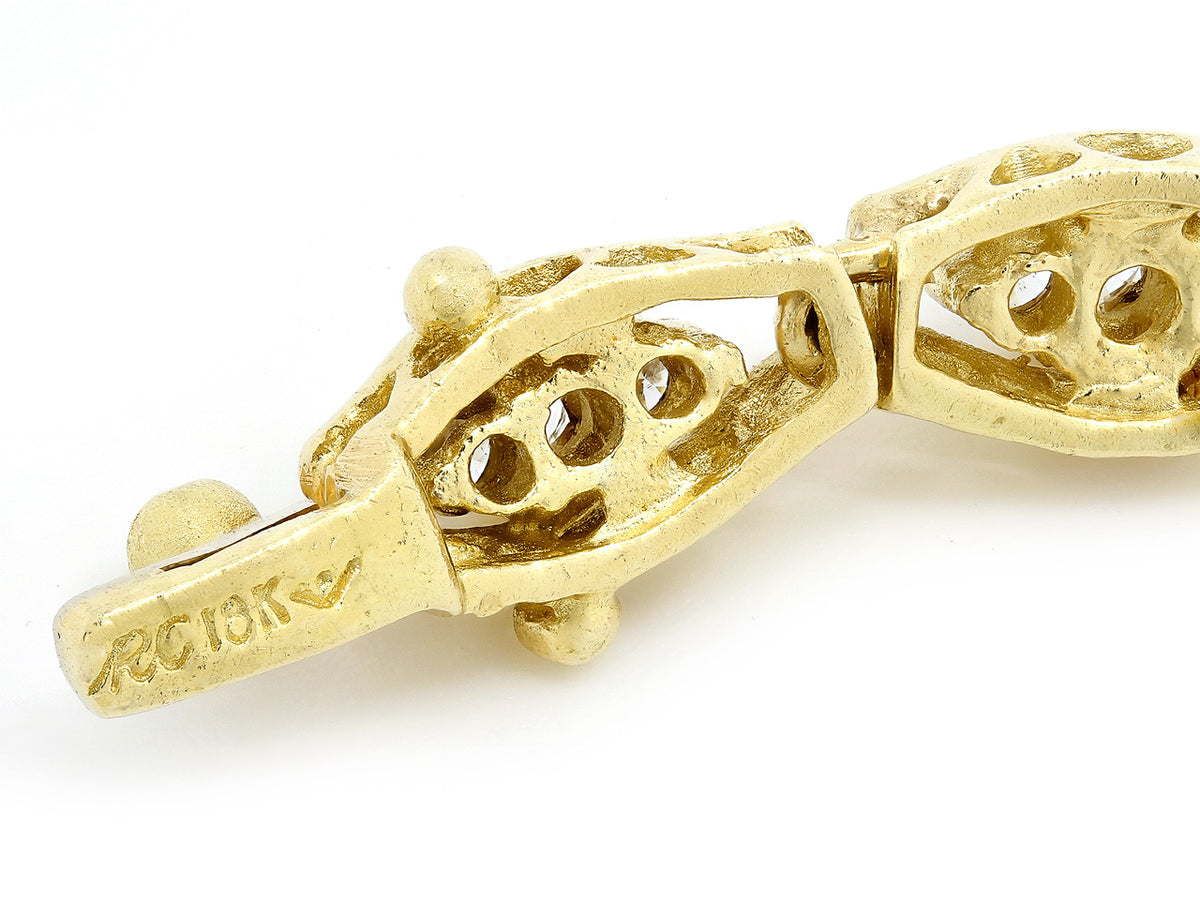 Close view of 18K gold bracelet clasp and navette links