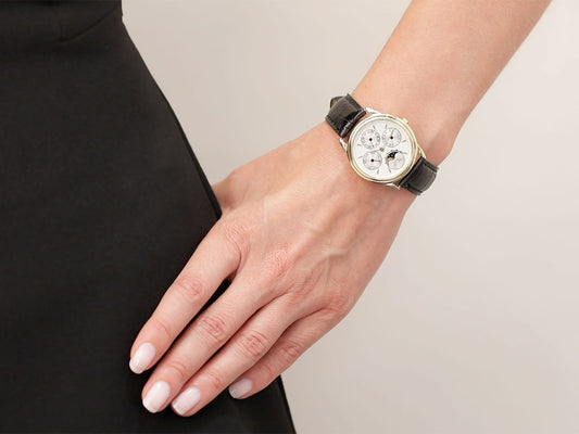 Piaget gold triple calendar watch on wrist
