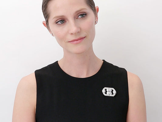 Platinum geometric diamond brooch on black dress