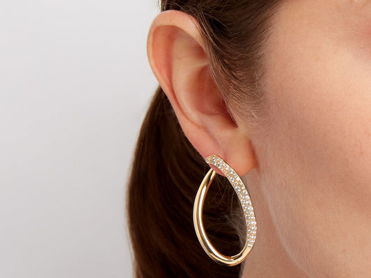 Diamond loop earring in polished 18K yellow gold