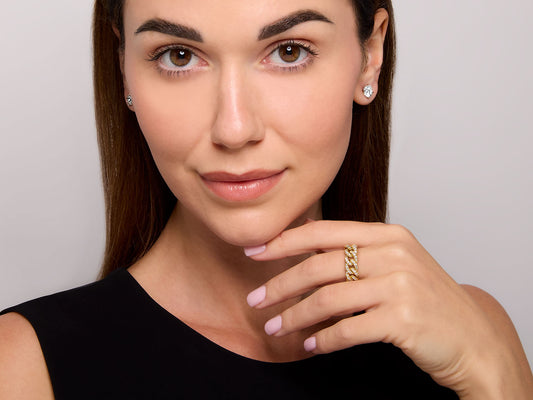 Woman wearing an 18K gold diamond link ring