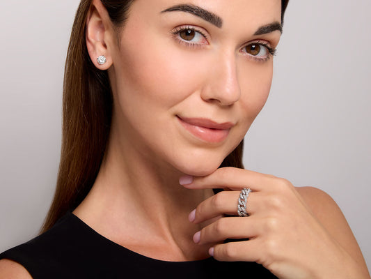 Woman wearing a diamond link ring in white gold