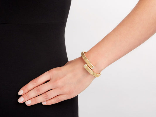 Gold tubogas bypass bracelet with diamond terminals
