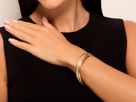 Stacked 18K yellow white and rose gold bangles