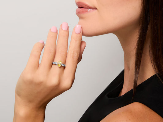 Woman wearing a marquise yellow diamond ring