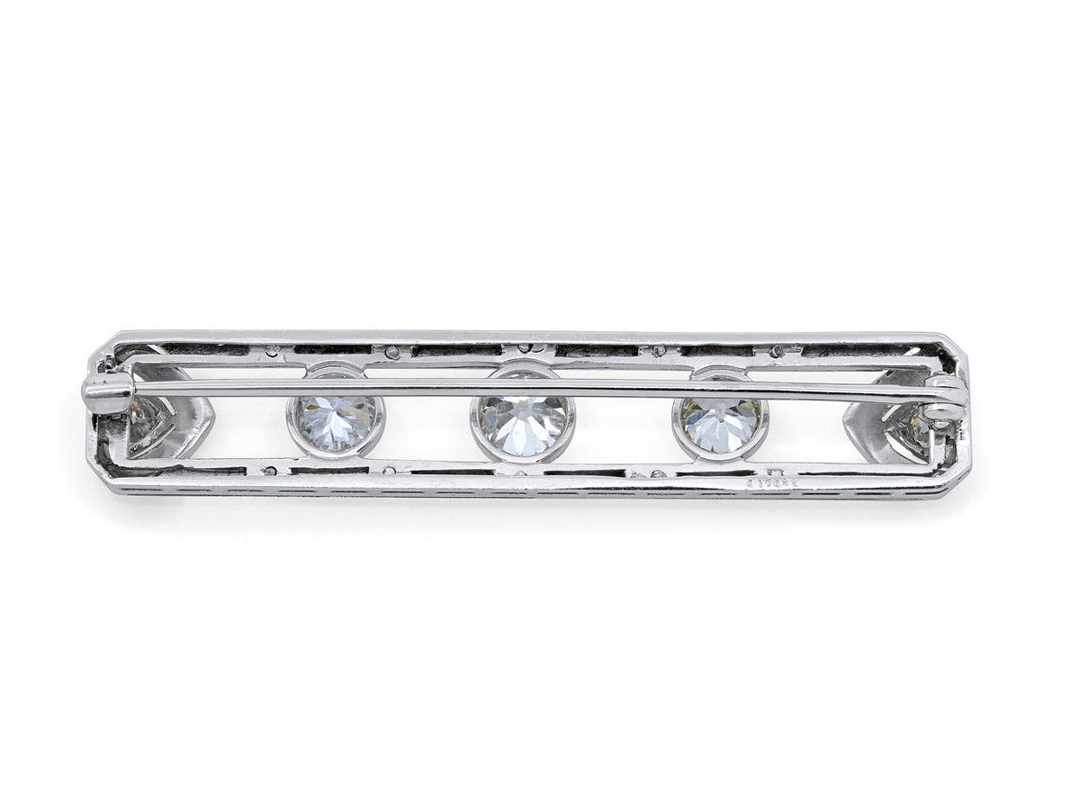 Platinum bar brooch with three bezel set diamonds