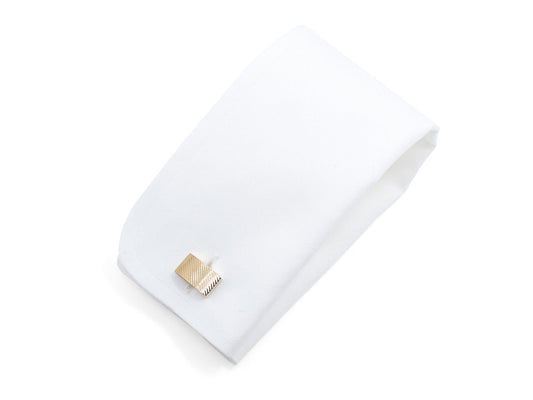 White jewelry pouch with a gold cufflink