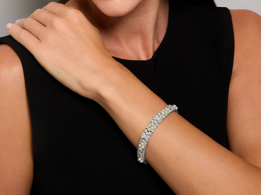 Diamond and natural pearl bracelet worn on wrist