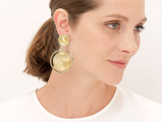 Model wearing Jean Mahie hammered 22K gold earrings
