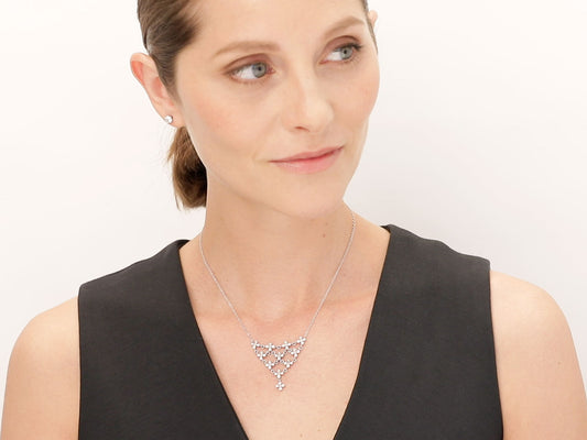 Woman wearing a platinum diamond petal necklace