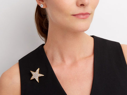 Diamond star brooch pinned to a black dress