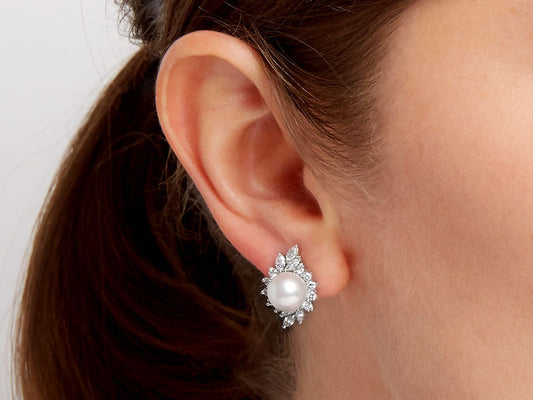 Pearl and diamond earring worn on ear