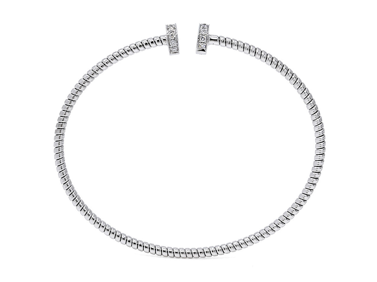 Slim 18K white gold tubogas bangle with nail head terminals